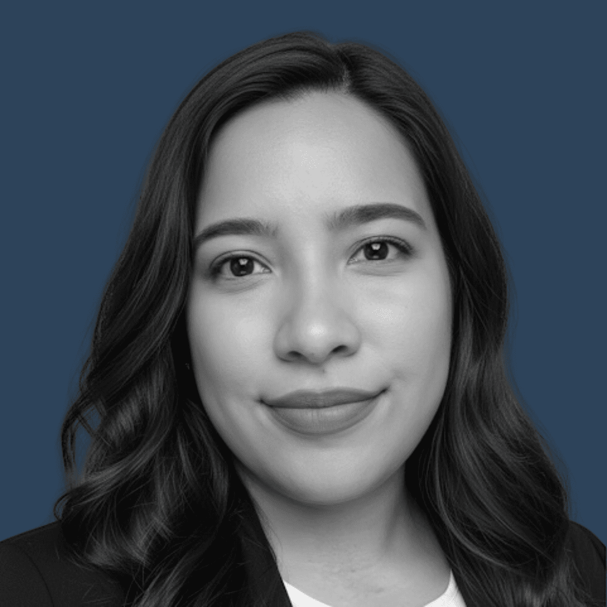 black and white headshot on dark blue background