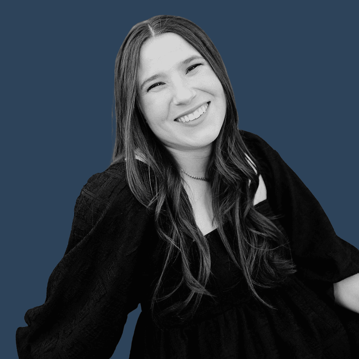 black and white headshot on dark blue background